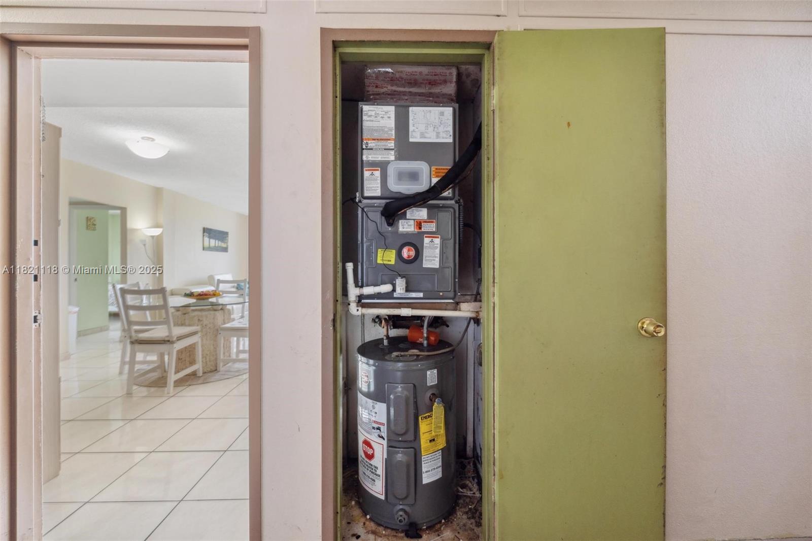 6705 Northwest 169th Street, Unit C310 Hialeah, FL 33015 - Photo 24 of 26 a view of a hallway with wooden floor and a bathroom