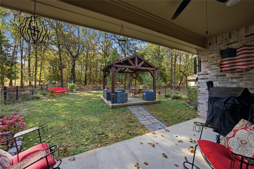 7222 Neches Street Athens, TX 75752 - Photo 20 of 27 a view of a porch with furniture and a yard
