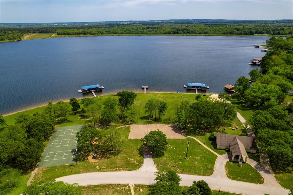 7222 Neches Street Athens, TX 75752 - Photo 23 of 27 an aerial view of a houses with a lake and lake view