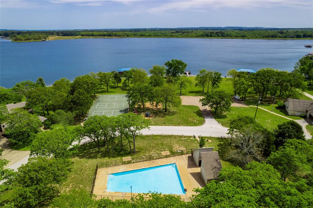 7222 Neches Street Athens, TX 75752 - Photo 24 of 27 an aerial view of a house with a lake view