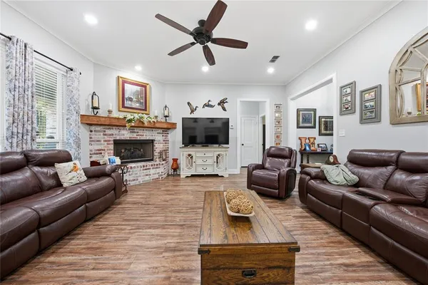a living room with furniture fireplace and a flat screen tv