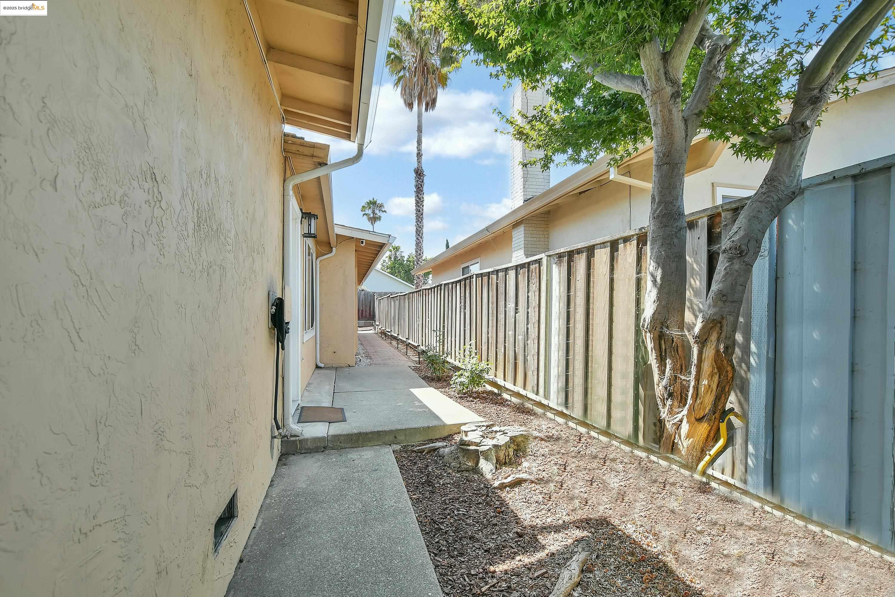 185 Evening Star Court Milpitas, CA 95035 - Photo 13 of 33 a view of a pathway of a house with wooden floor
