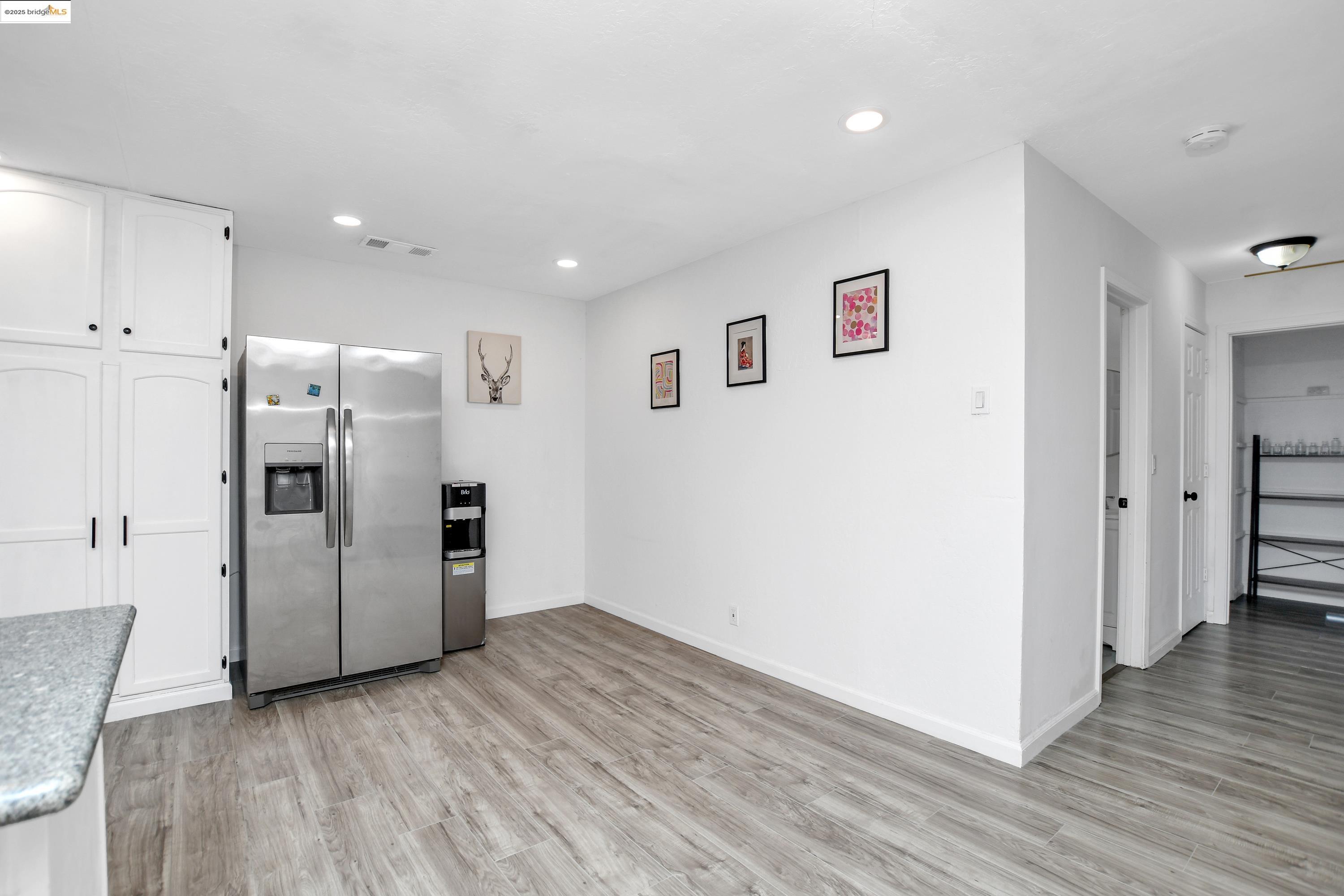 185 Evening Star Court Milpitas, CA 95035 - Photo 24 of 33 a view of a kitchen with a refrigerator and a stove