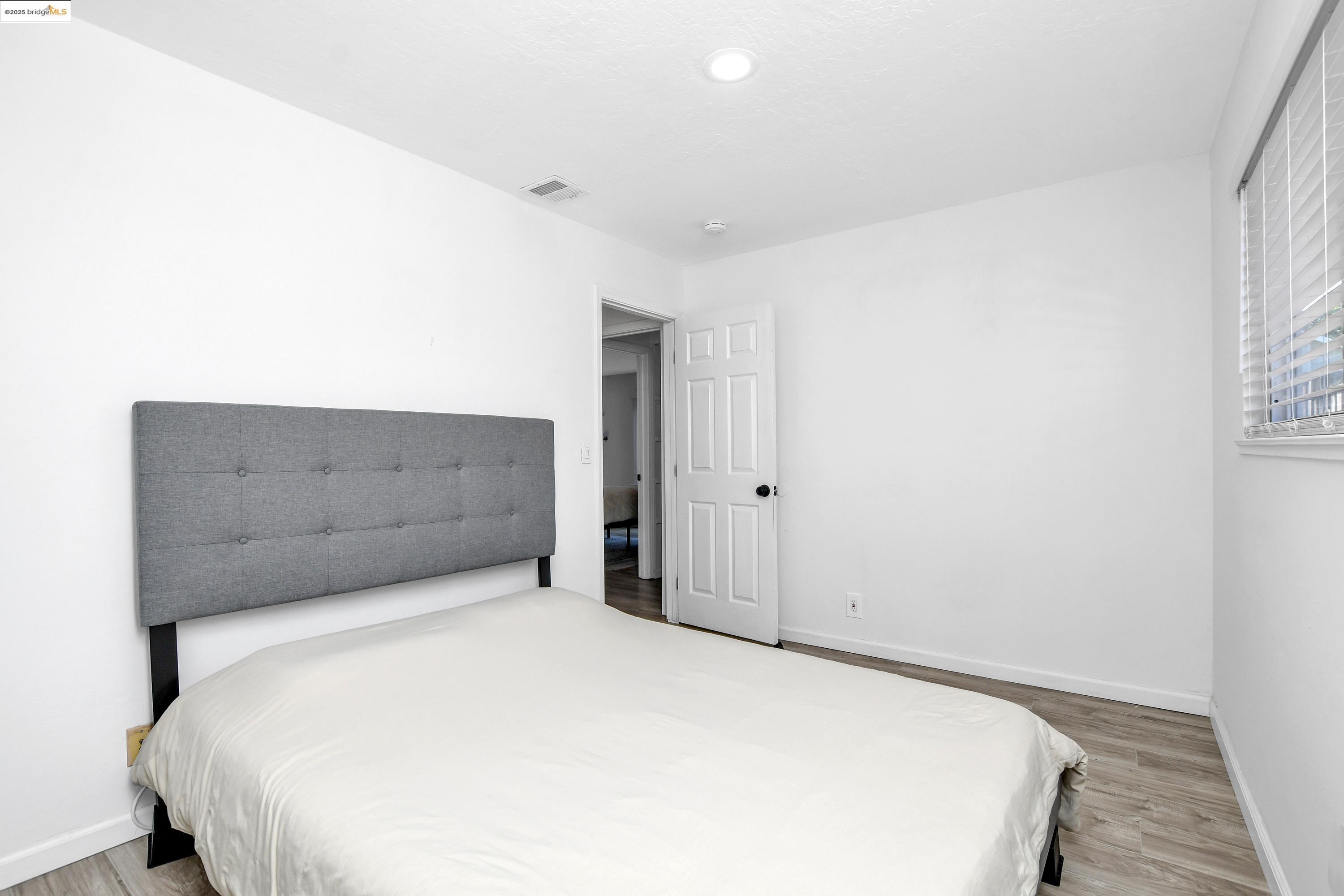 185 Evening Star Court Milpitas, CA 95035 - Photo 27 of 33 a bedroom with a bed and cabinet