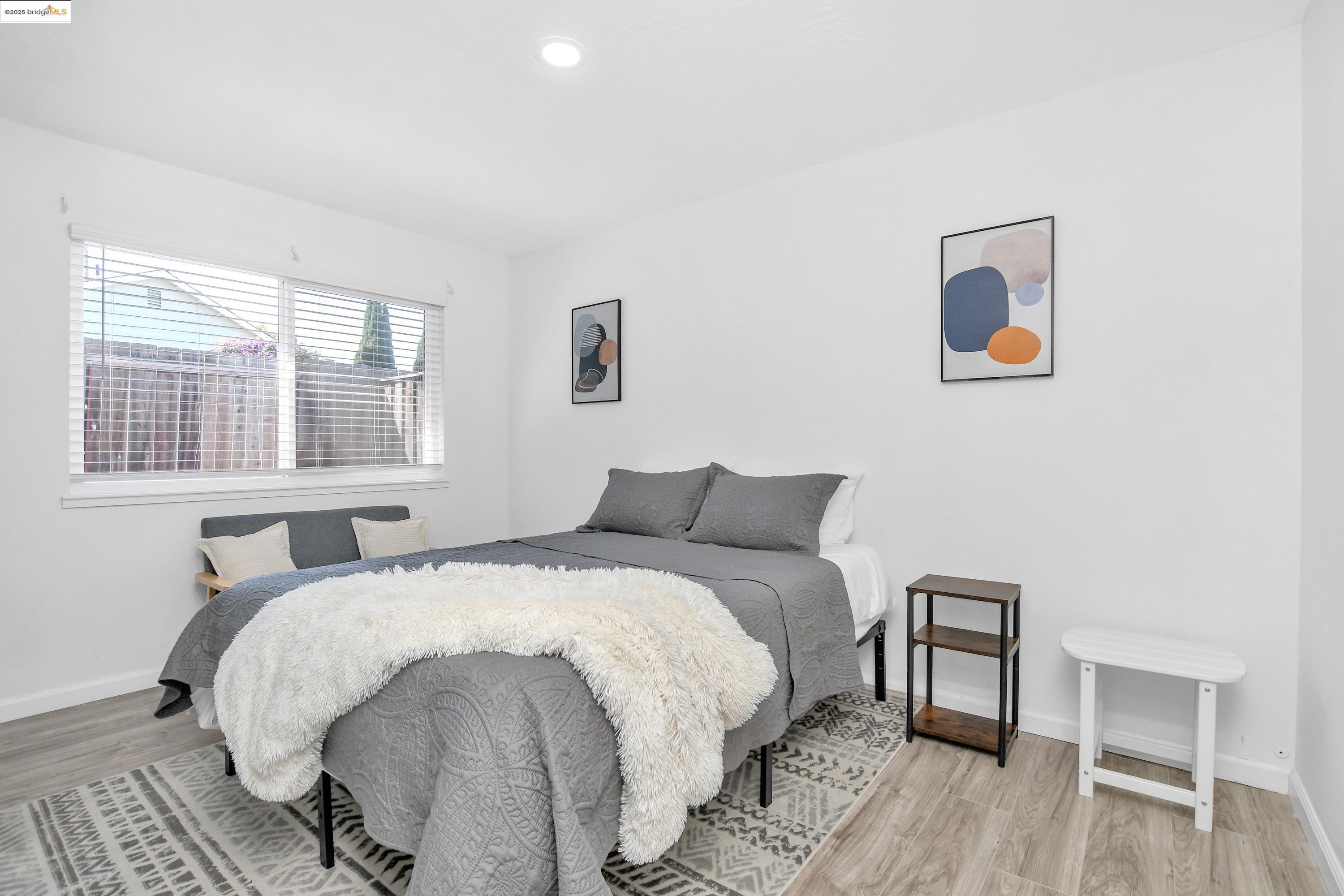 185 Evening Star Court Milpitas, CA 95035 - Photo 28 of 33 a bed sitting in a bedroom next to a window