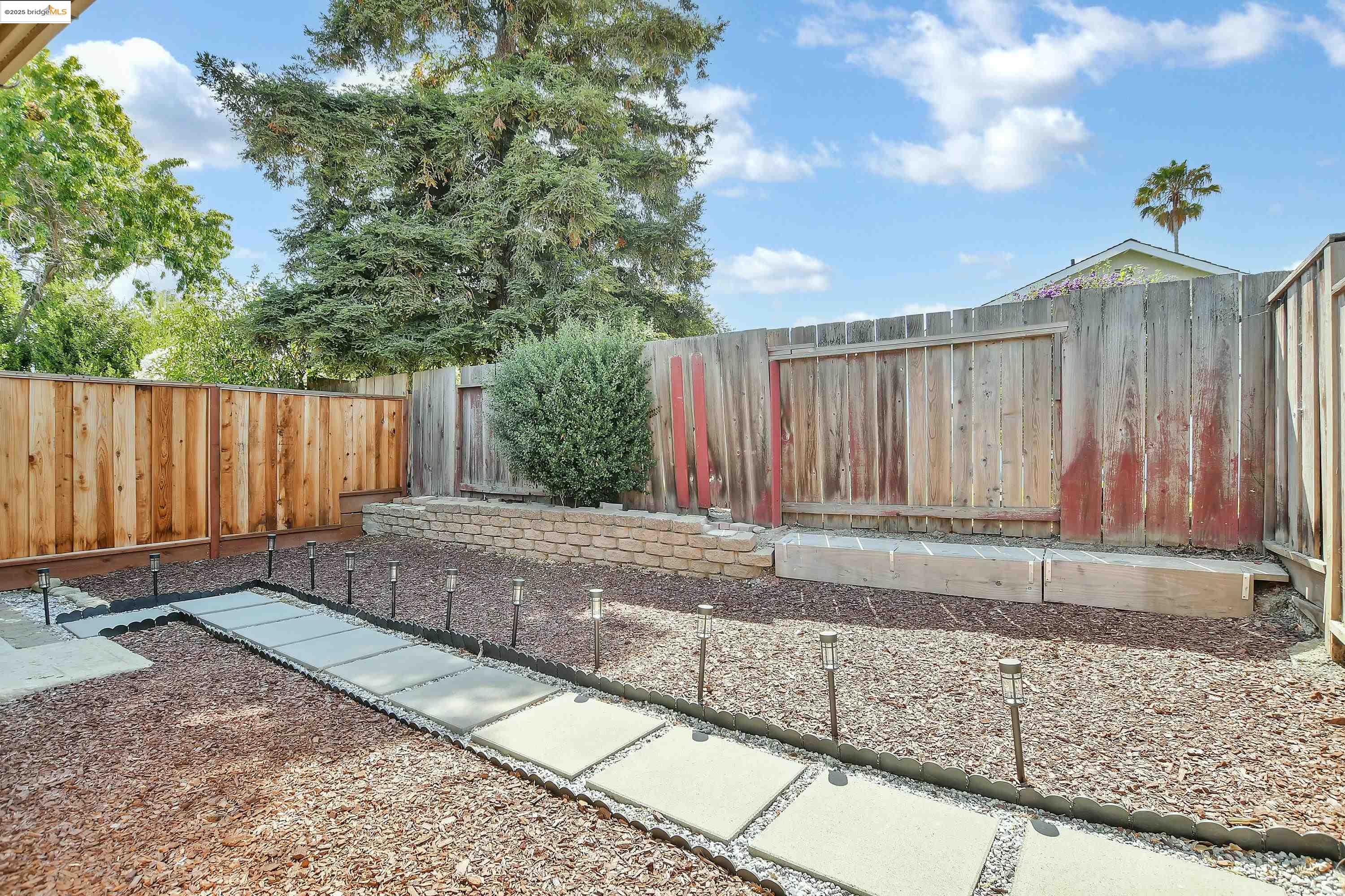 185 Evening Star Court Milpitas, CA 95035 - Photo 3 of 33 a view of a backyard with wooden fence