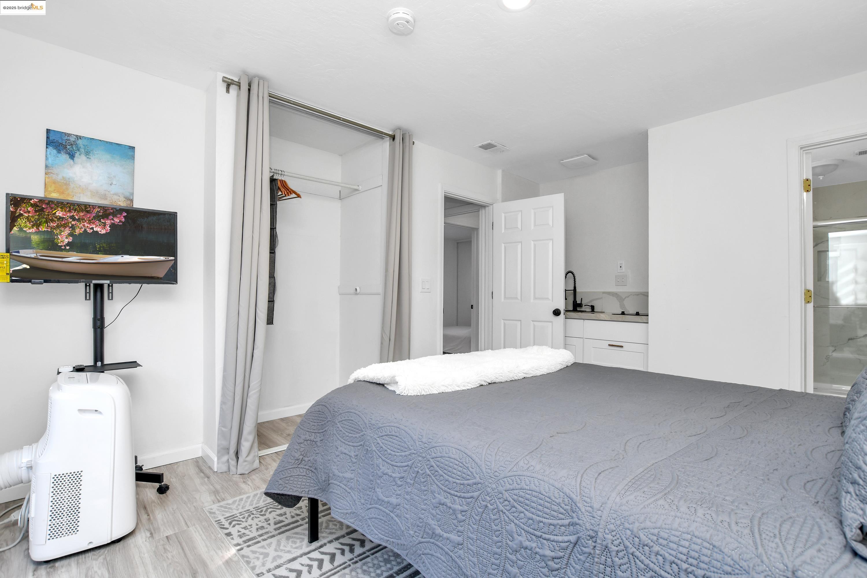 185 Evening Star Court Milpitas, CA 95035 - Photo 31 of 33 a bedroom with a bed and a mirror