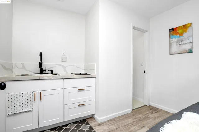 a bathroom with a sink a vanity and mirror