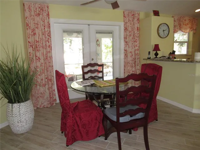 a view of a dining room with furniture and window
