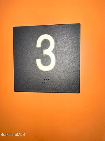 a kitchen with a sink and natural light