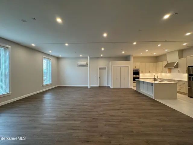 a bathroom with a sink a mirror and bathtub