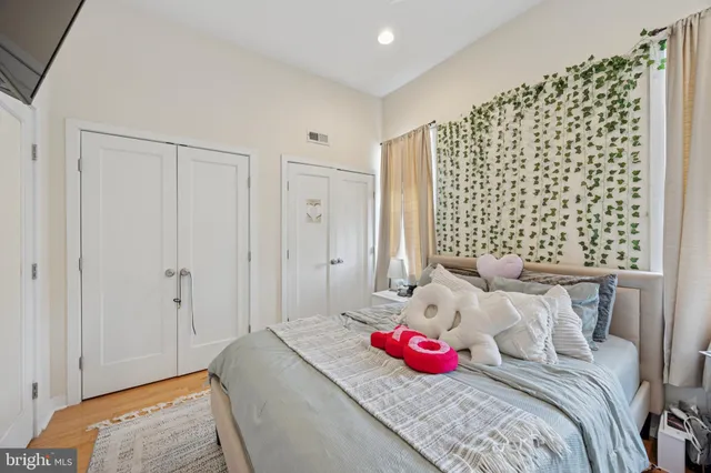 a bedroom with a bed and a couch