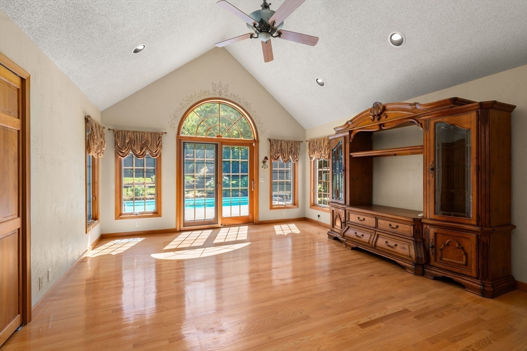 2035 Parker Street Springfield, MA 01128 - Photo 5 of 42 a view of an empty room with wooden floor and a window