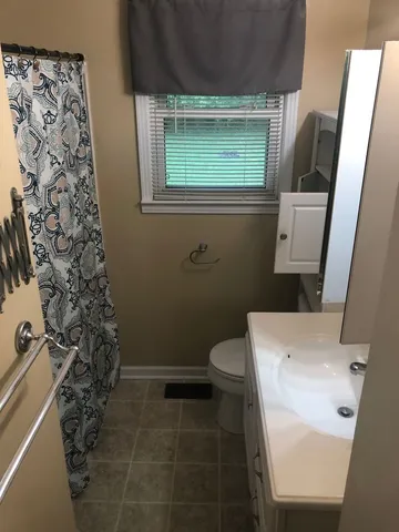 a bathroom with a toilet and a sink