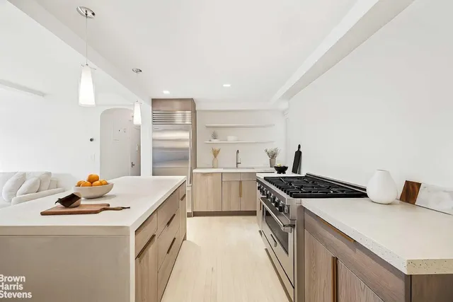 a kitchen that has a sink and a stove