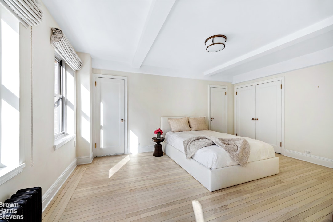 433 East 51st Street, Unit 9A Manhattan, NY 10022 - Photo 6 of 19 a bed room with a bed and a window