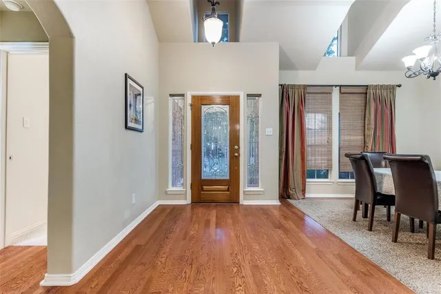 a view of a room with furniture and wooden floor