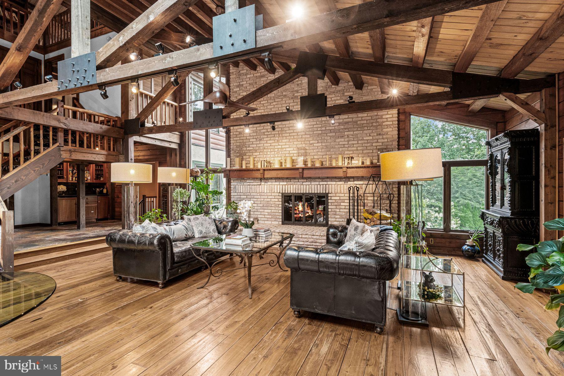 1408 Rene Road Villanova, PA 19085 - Photo 17 of 66 a living room with fireplace furniture and a wooden floor