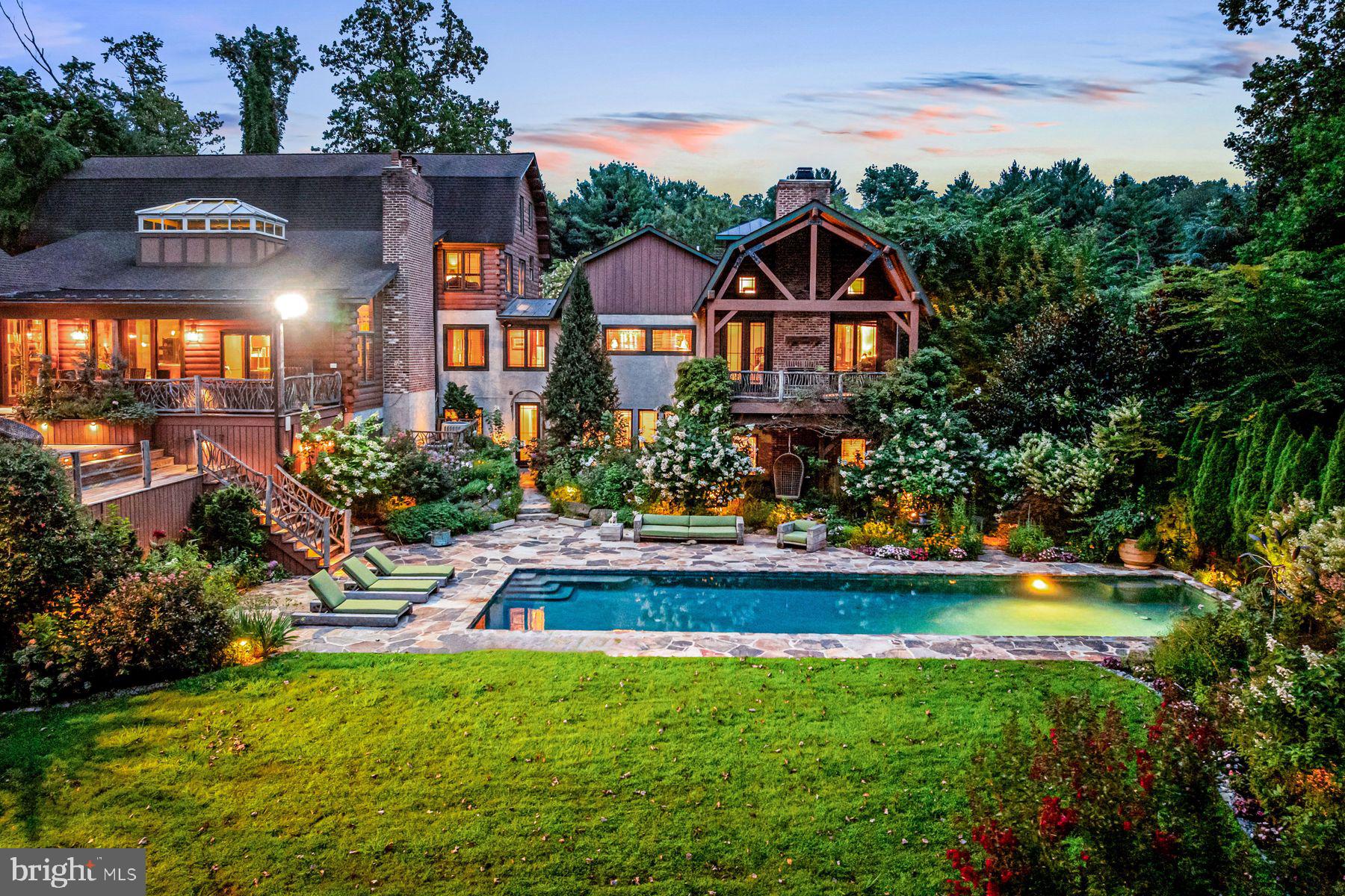 1408 Rene Road Villanova, PA 19085 - Photo 2 of 66 a front view of a house with swimming pool having outdoor seating
