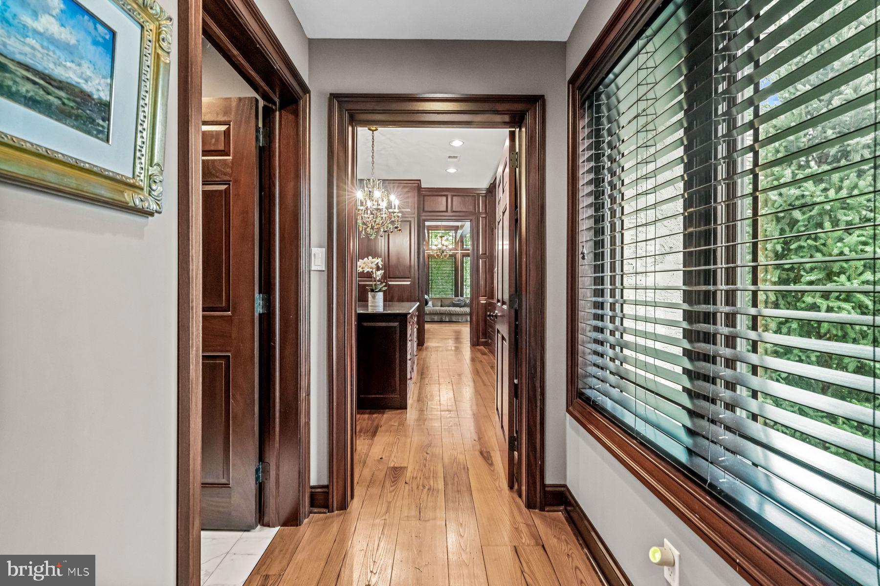 1408 Rene Road Villanova, PA 19085 - Photo 27 of 66 a view of a hallway with wooden floor and staircase