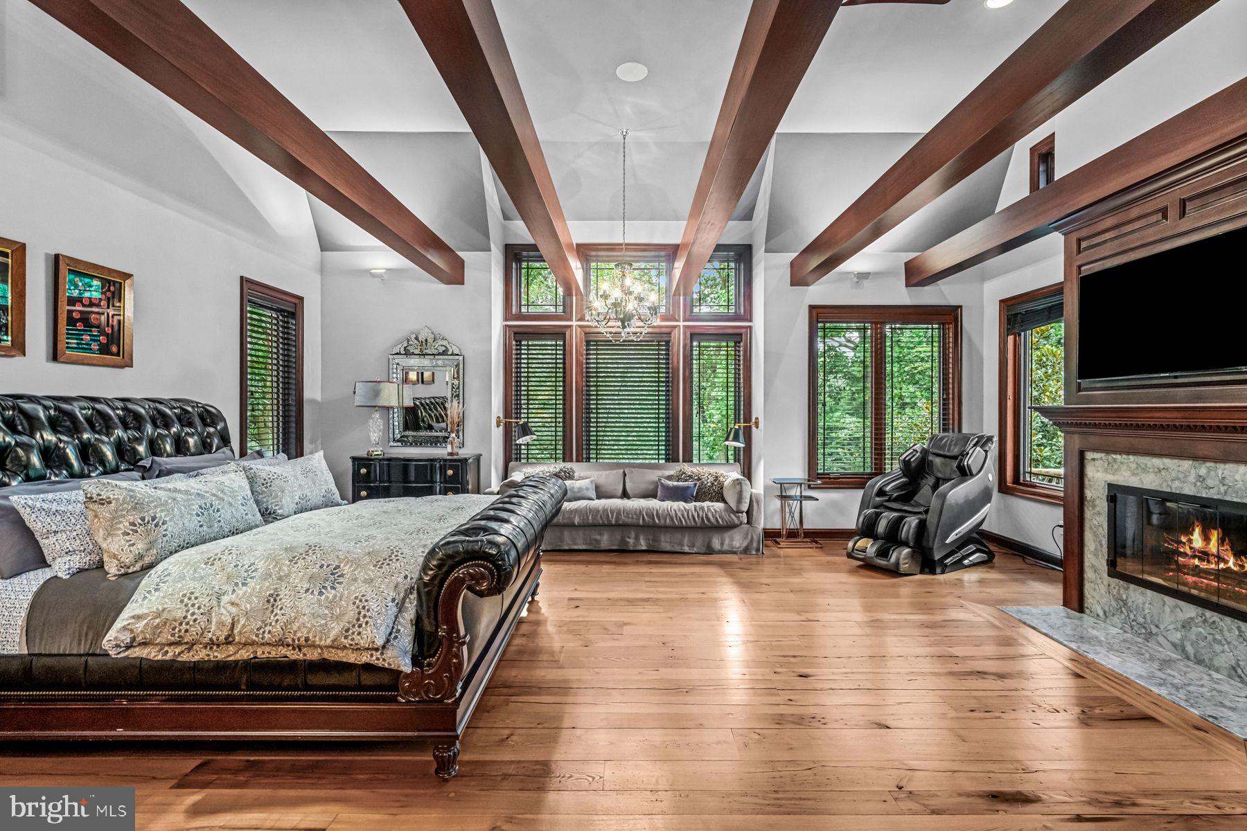 1408 Rene Road Villanova, PA 19085 - Photo 30 of 66 a spacious bedroom with a balcony a bed and a couch