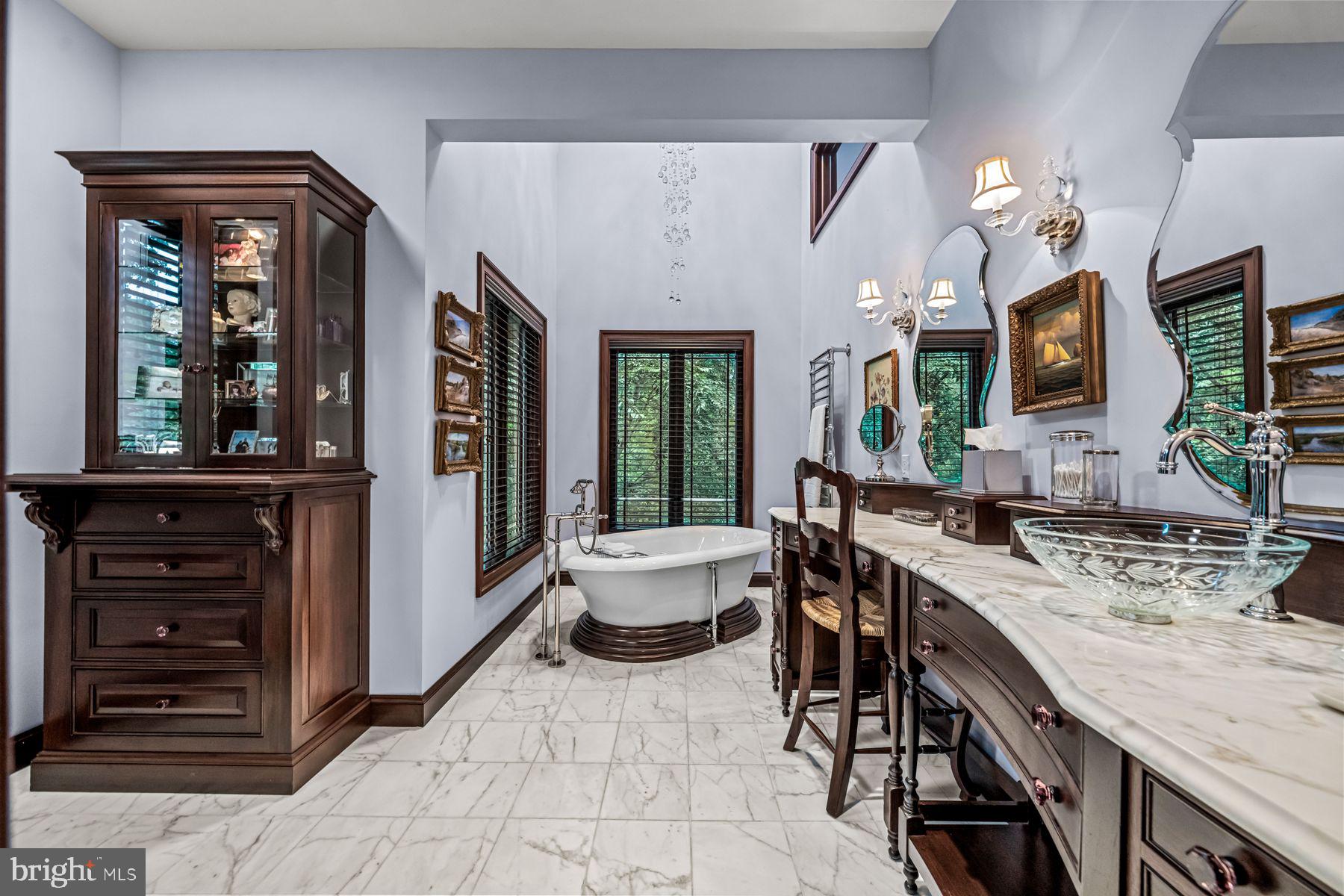 1408 Rene Road Villanova, PA 19085 - Photo 33 of 66 a spacious en suite bathroom with a granite countertop sink and a large mirror