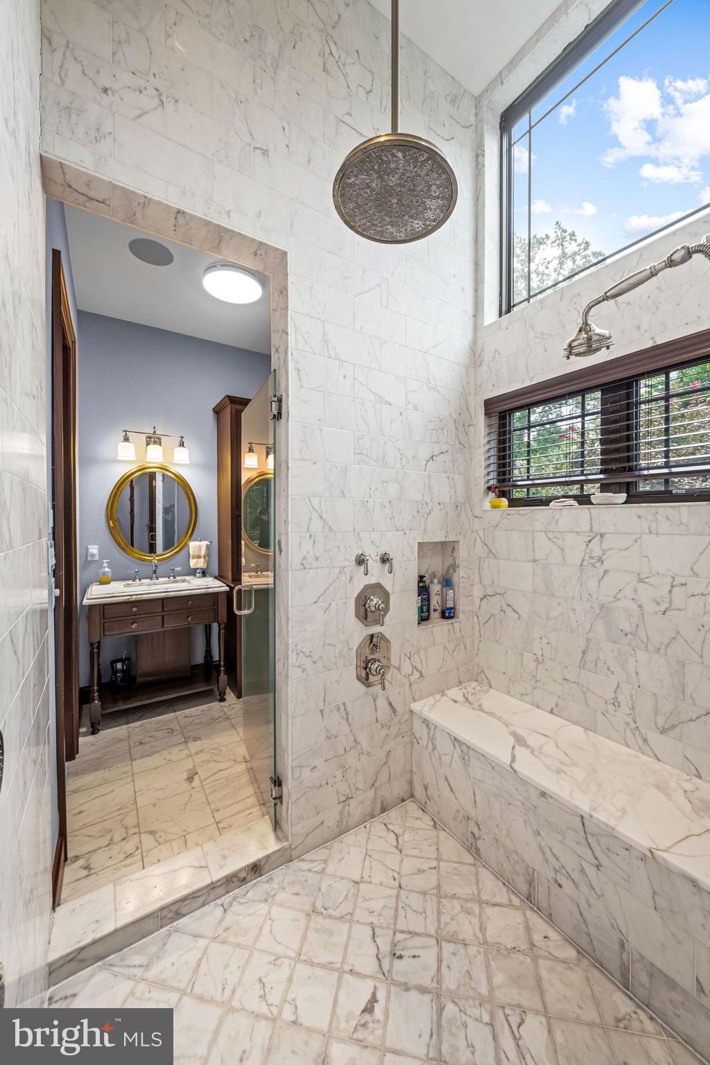 1408 Rene Road Villanova, PA 19085 - Photo 35 of 66 a bathroom with a tub a window and a shower