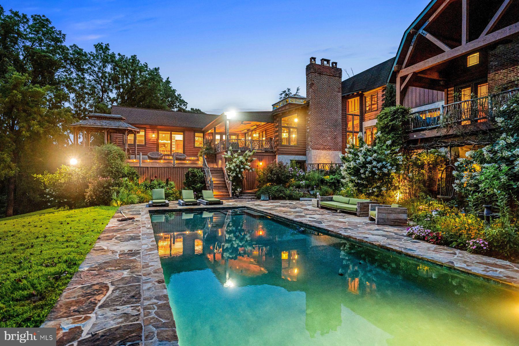 1408 Rene Road Villanova, PA 19085 - Photo 4 of 66 a swimming pool with outdoor seating and yard