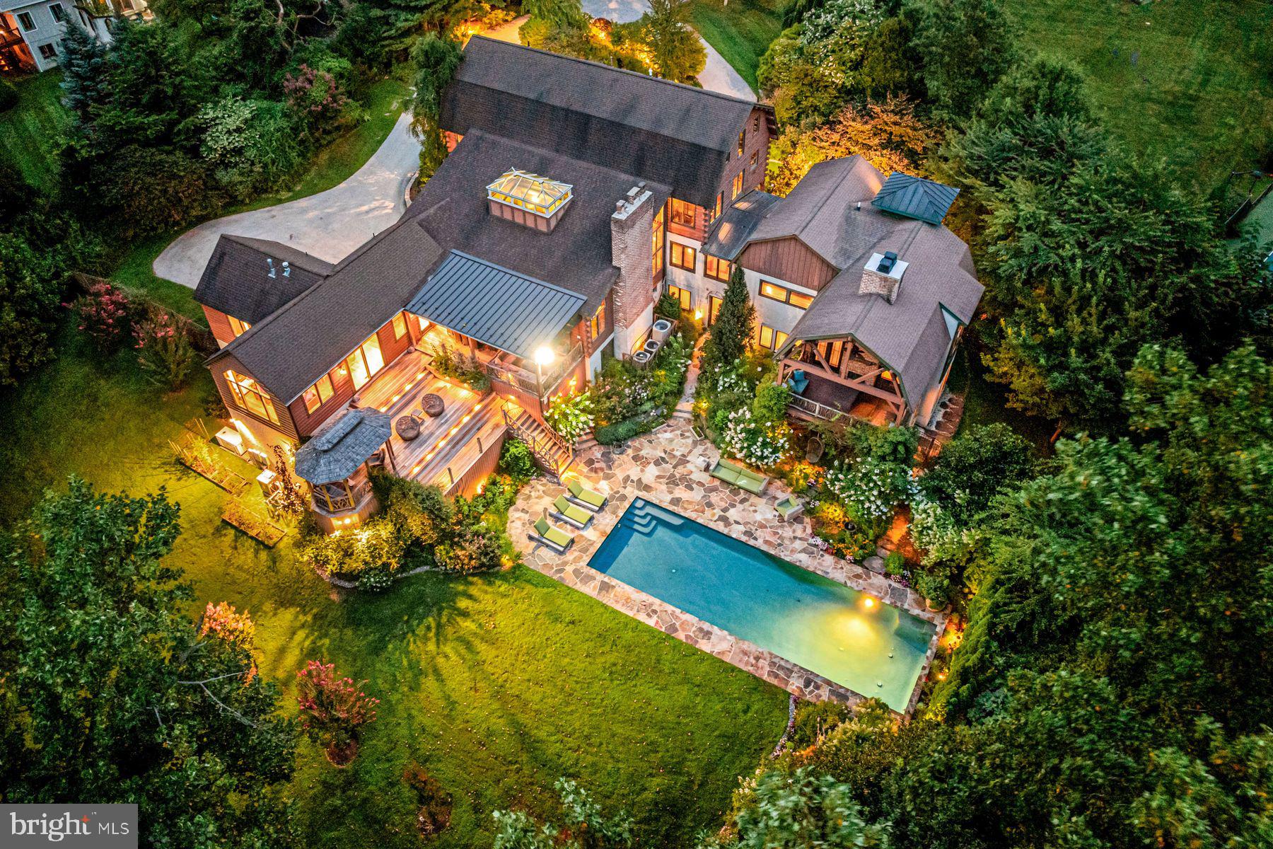 1408 Rene Road Villanova, PA 19085 - Photo 5 of 66 an aerial view of a house with a garden and swimming pool