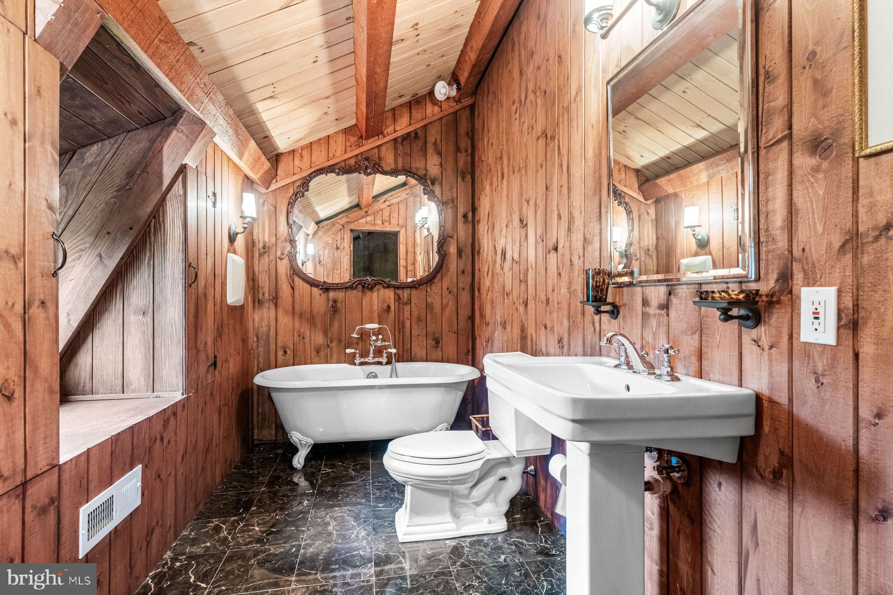 1408 Rene Road Villanova, PA 19085 - Photo 52 of 66 a bathroom with a sink a toilet and a mirror