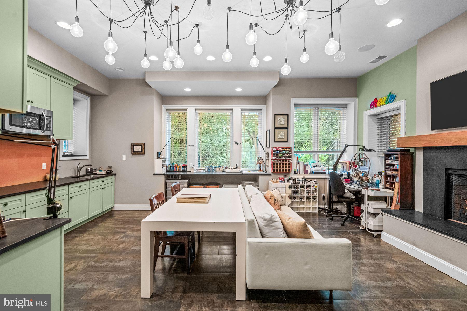 1408 Rene Road Villanova, PA 19085 - Photo 54 of 66 a living room with furniture a flat screen tv and a large window