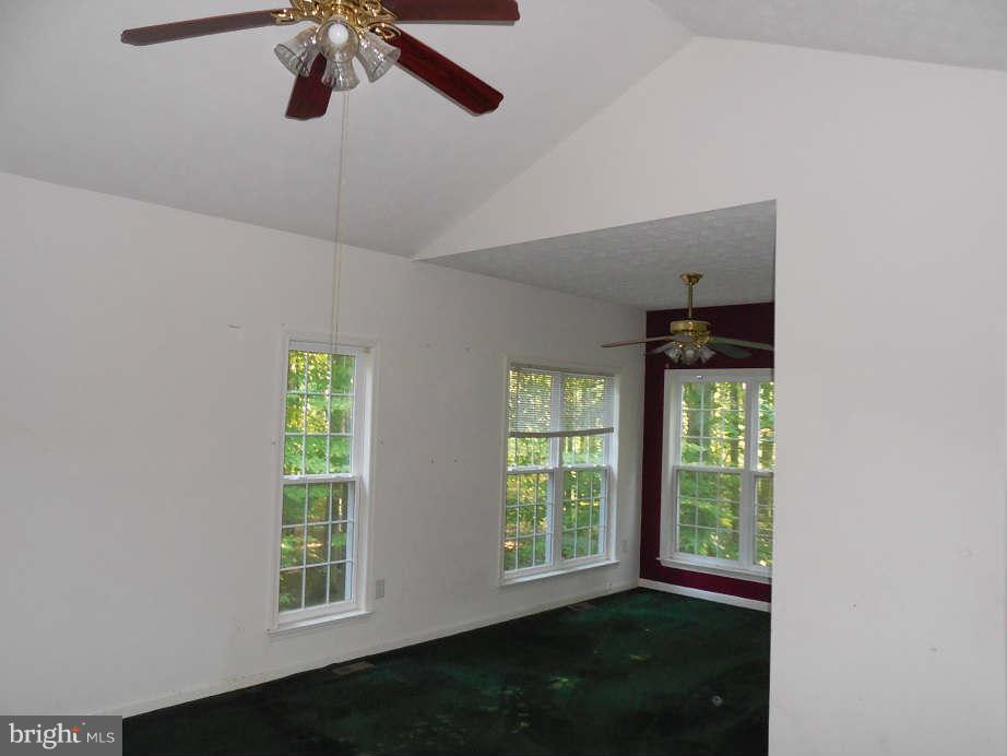 258 Cedar Ridge Drive Ruther Glen, VA 22546 - Photo 11 of 29 an empty room with windows and closet