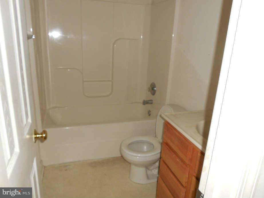258 Cedar Ridge Drive Ruther Glen, VA 22546 - Photo 17 of 29 a bathroom with a toilet and a shower