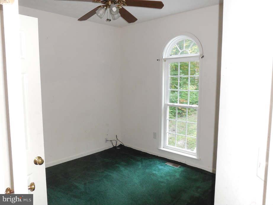 258 Cedar Ridge Drive Ruther Glen, VA 22546 - Photo 19 of 29 a view of empty room with windows