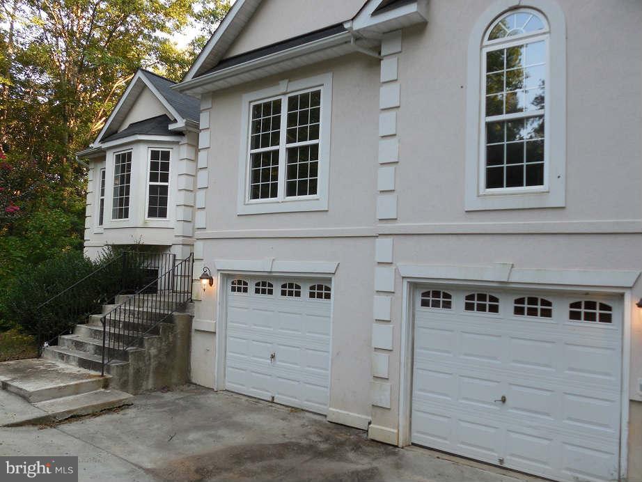 258 Cedar Ridge Drive Ruther Glen, VA 22546 - Photo 3 of 29 a front view of a house with windows