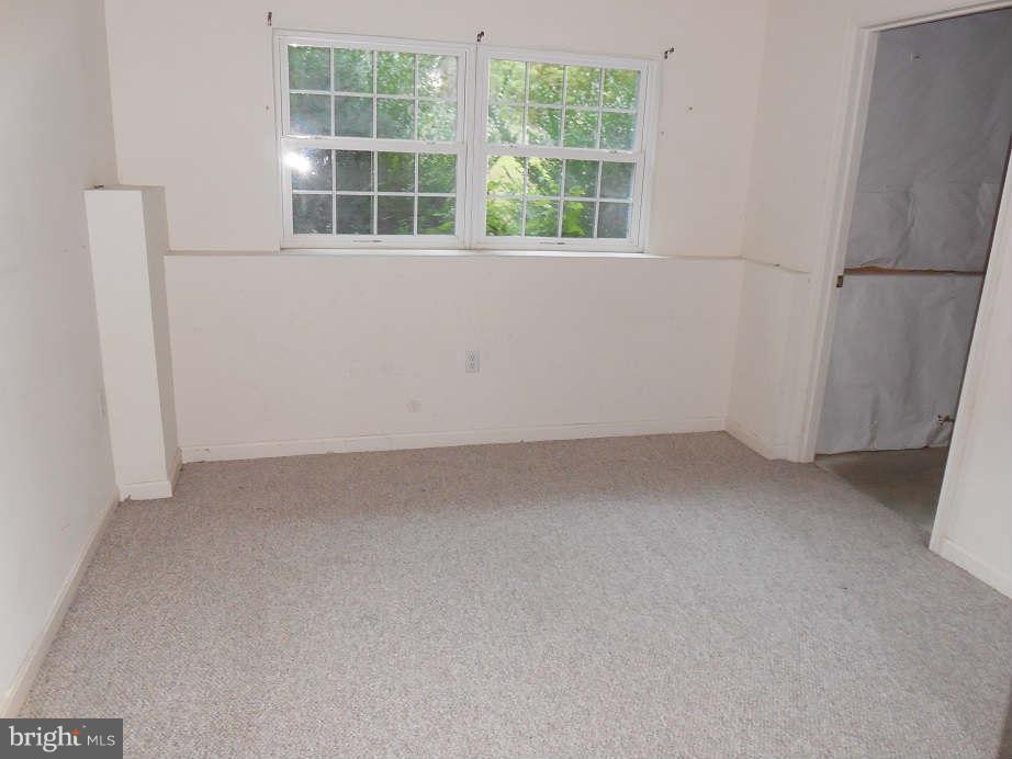258 Cedar Ridge Drive Ruther Glen, VA 22546 - Photo 21 of 29 a view of a room that has a window in it
