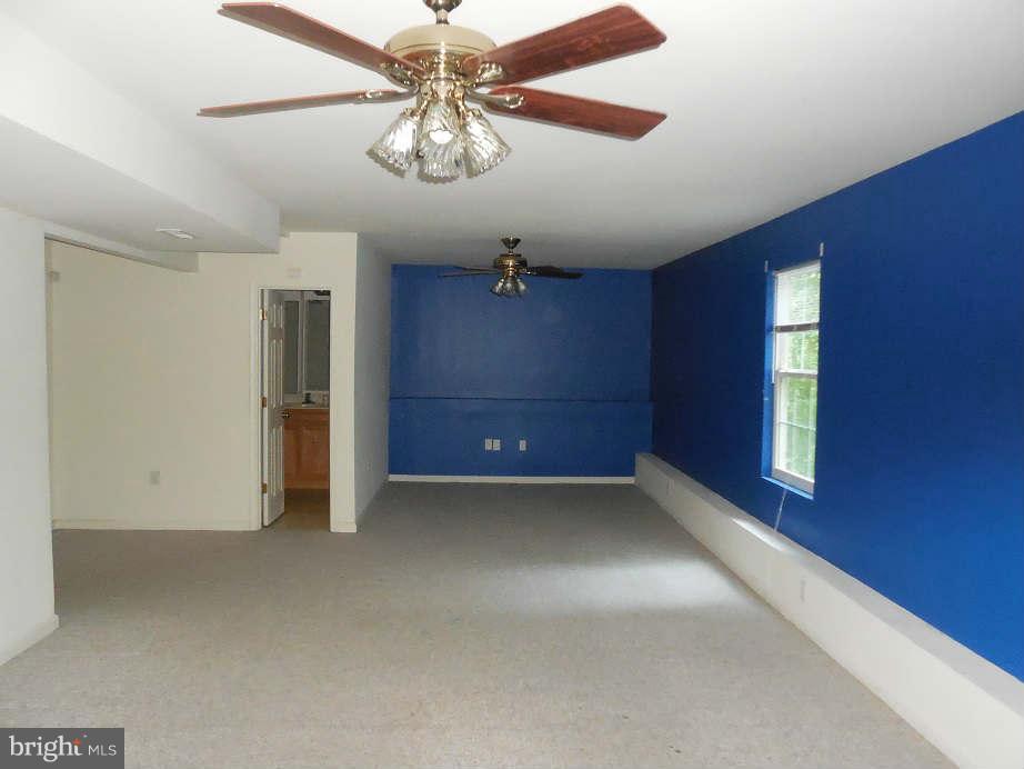 258 Cedar Ridge Drive Ruther Glen, VA 22546 - Photo 25 of 29 wooden floor in an empty room with a window