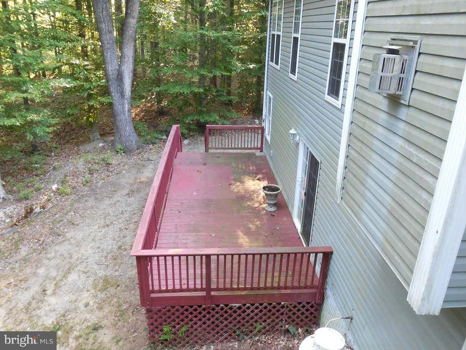 258 Cedar Ridge Drive Ruther Glen, VA 22546 - Photo 29 of 29 a view of backyard with a deck