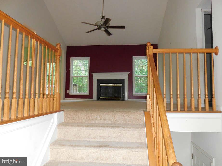 258 Cedar Ridge Drive Ruther Glen, VA 22546 - Photo 5 of 29 a living room with furniture and a fireplace