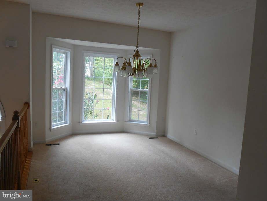 258 Cedar Ridge Drive Ruther Glen, VA 22546 - Photo 6 of 29 a view of livingroom with window and chandelier