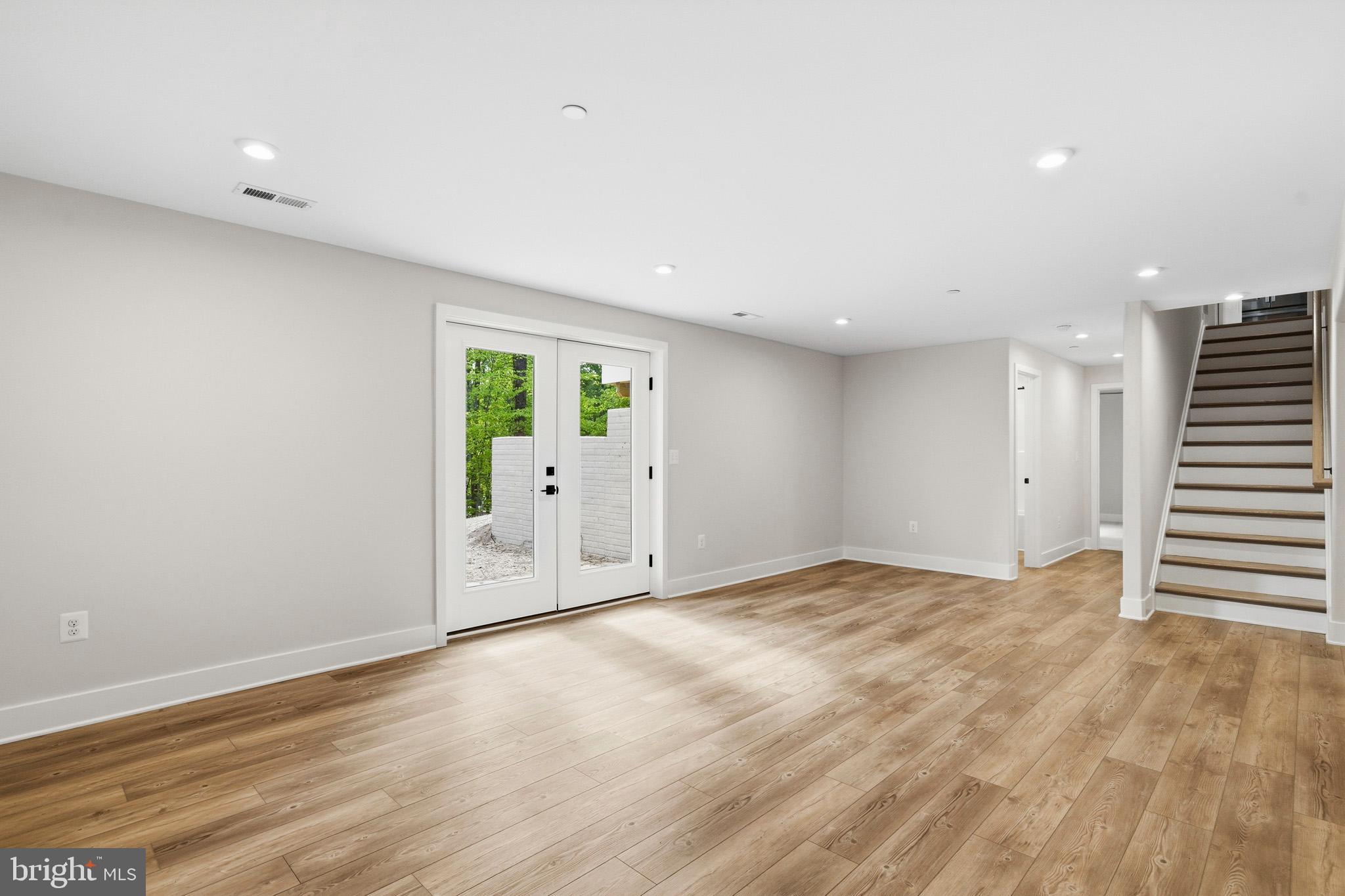 1362 Solomons Island Road Huntingtown, MD 20639 - Photo 32 of 37 a view of an empty room with wooden floor