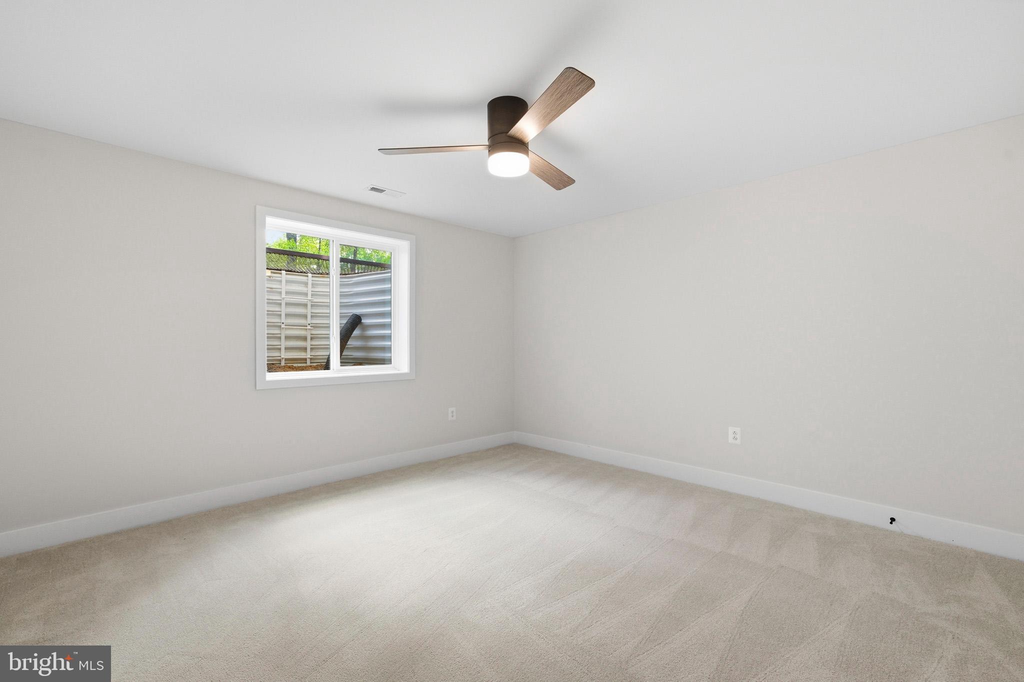 1362 Solomons Island Road Huntingtown, MD 20639 - Photo 34 of 37 an empty room with a window