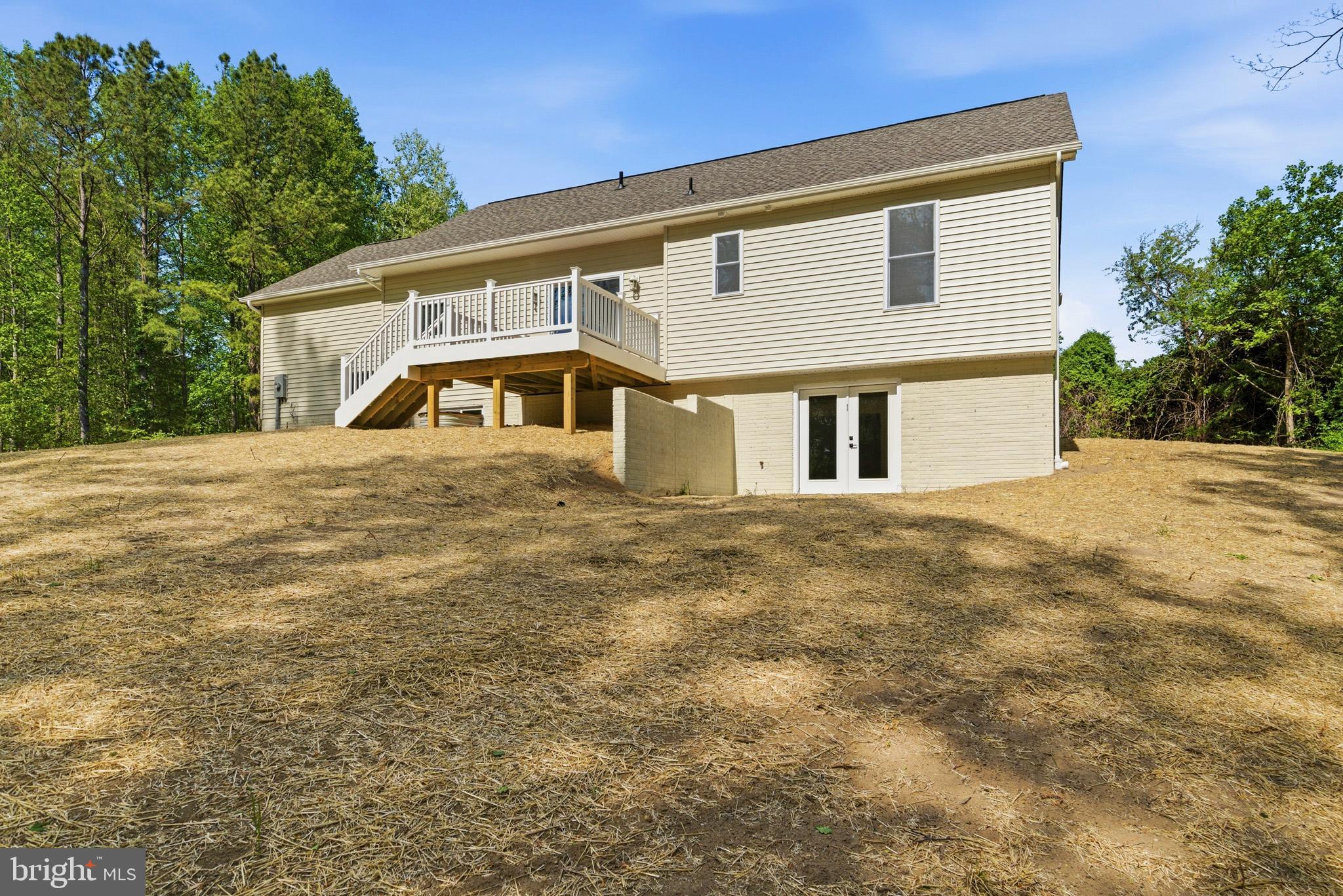 1362 Solomons Island Road Huntingtown, MD 20639 - Photo 4 of 37 a front view of a house with a garden