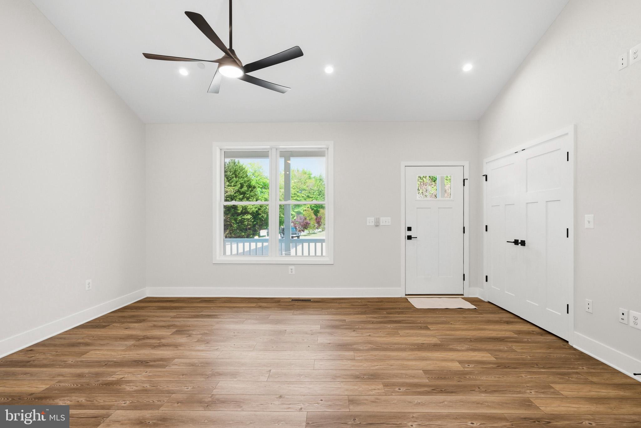 1362 Solomons Island Road Huntingtown, MD 20639 - Photo 7 of 37 wooden floor in an empty room
