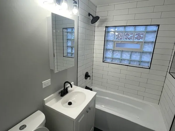a bathroom with a sink and a bathtub