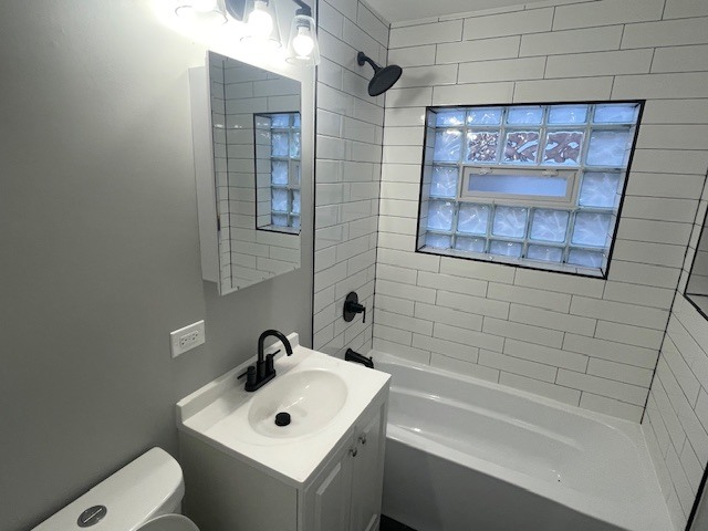 417 Hickory Street, Unit 1 Chicago Heights, IL 60411 - Photo 7 of 7 a bathroom with a sink and a bathtub