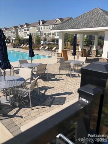 a view of a patio with swimming pool