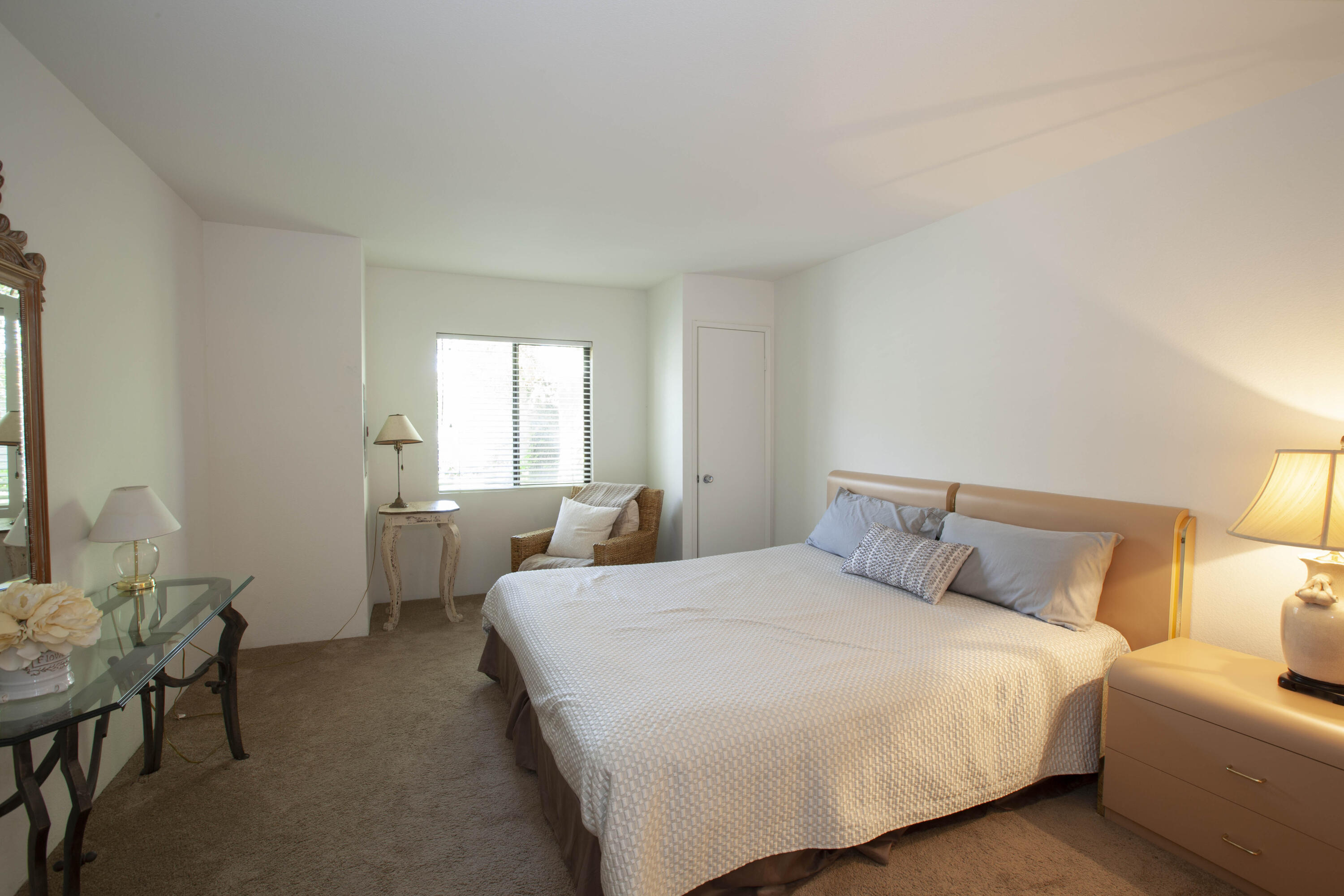 76131 Impatiens Circle Palm Desert, CA 92211 - Photo 11 of 27 a bedroom with a bed and a window