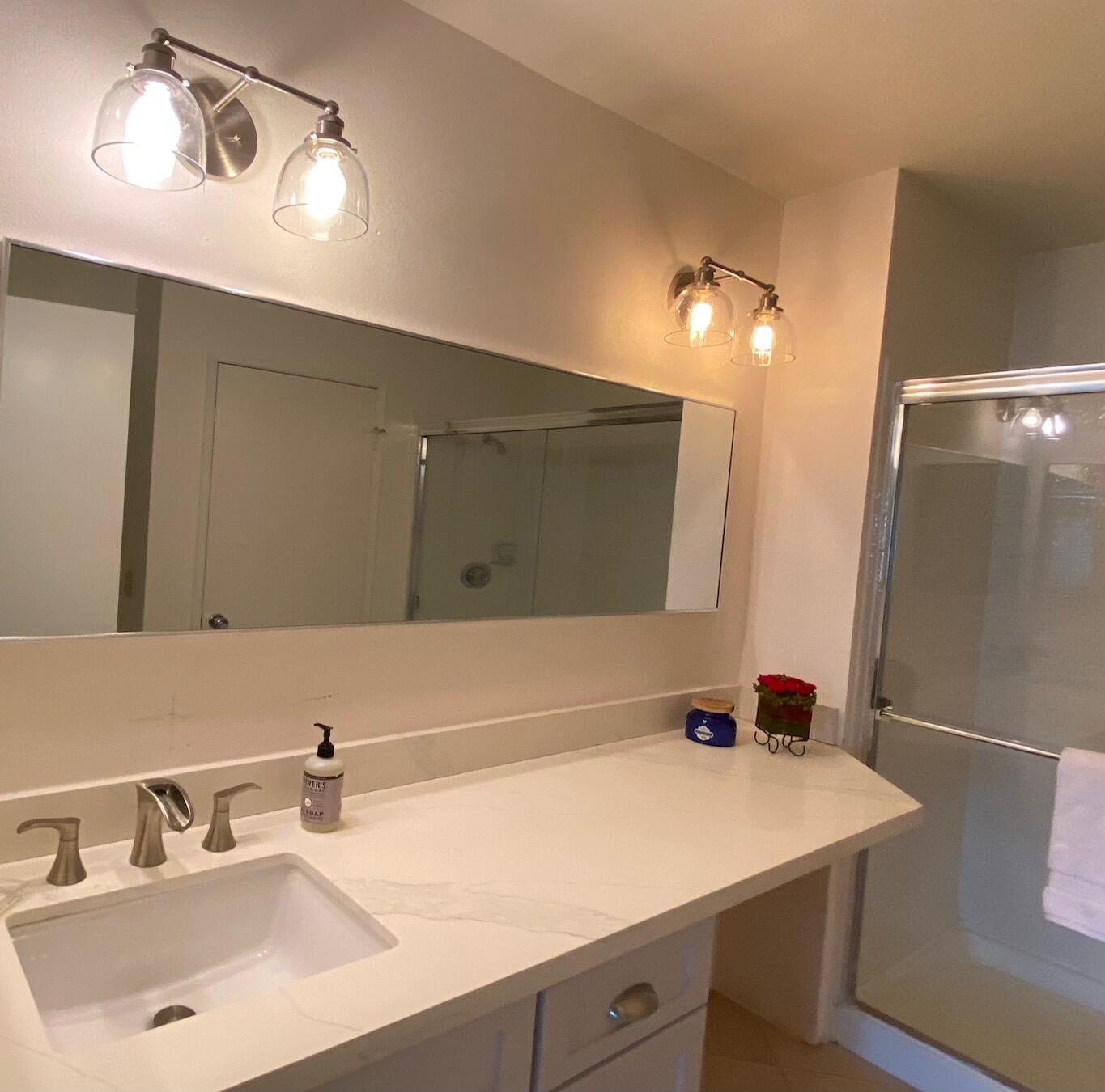 76131 Impatiens Circle Palm Desert, CA 92211 - Photo 14 of 27 a bathroom with a sink and a mirror