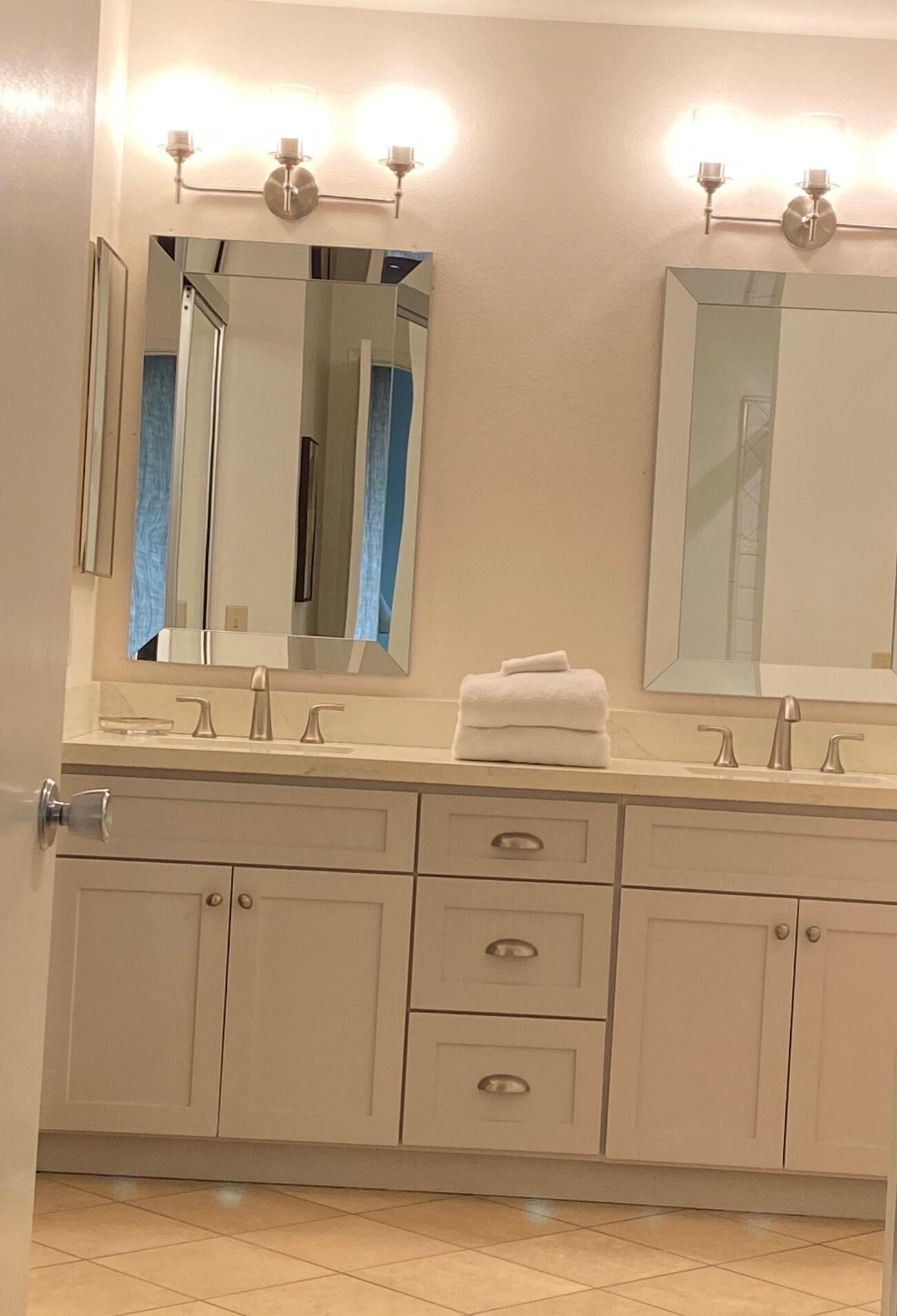 76131 Impatiens Circle Palm Desert, CA 92211 - Photo 18 of 27 a bathroom with a sink vanity granite and a mirror